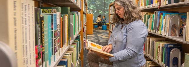 Person reading in the Helen Fowler Library