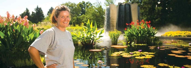 Person in the Four Towers Pool surrounded by waterlilies